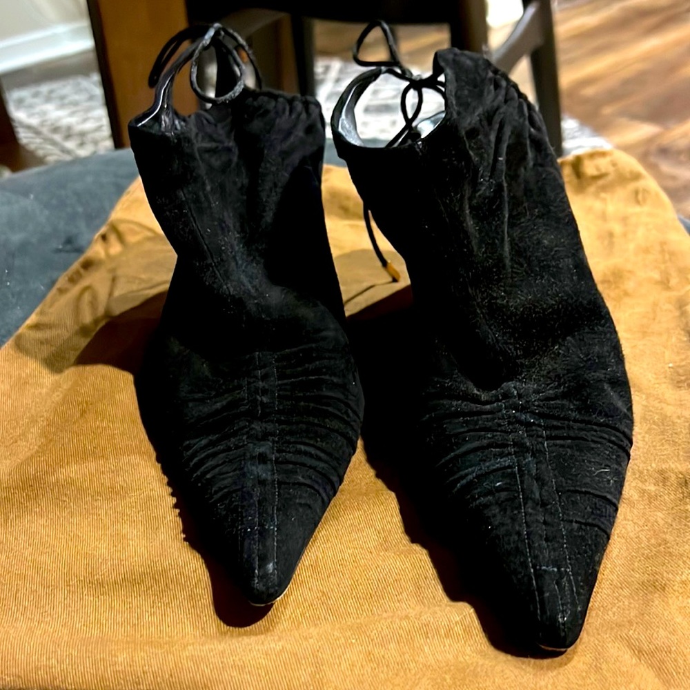 Gucci suede booties with an opening at the heels. Comes with dust bag.